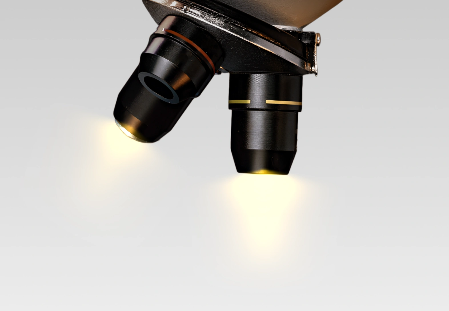 Lab technician using a tablet near a microscope